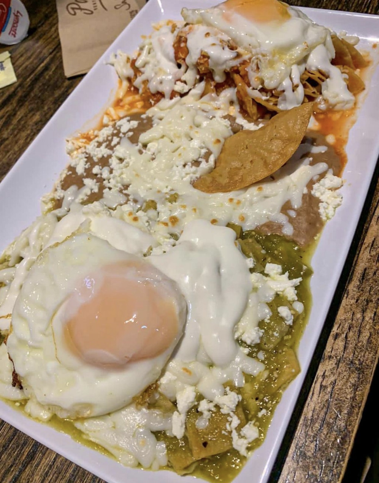 Half Chicken Chilaquiles Verdes & Half Chicken Chilaquiles Rojos Mexican Breakfast Plate