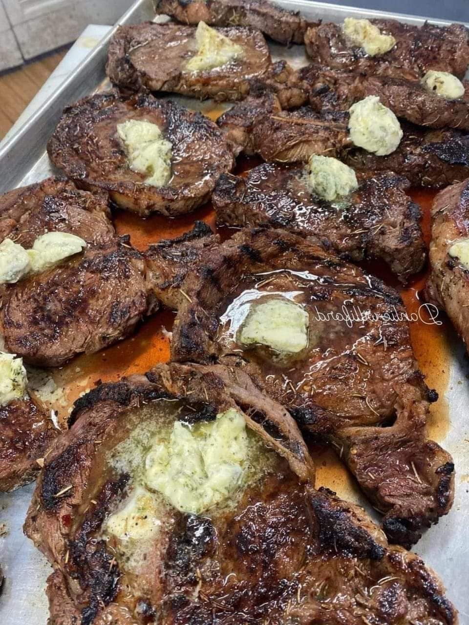 Grilled Ribeye Steaks with Herb Butter