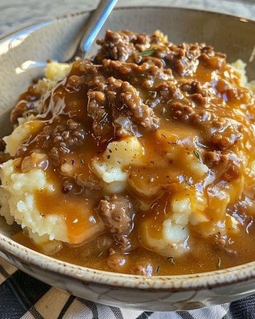 GROUND BEEF AND GRAVY OVER MASHED POTATOES